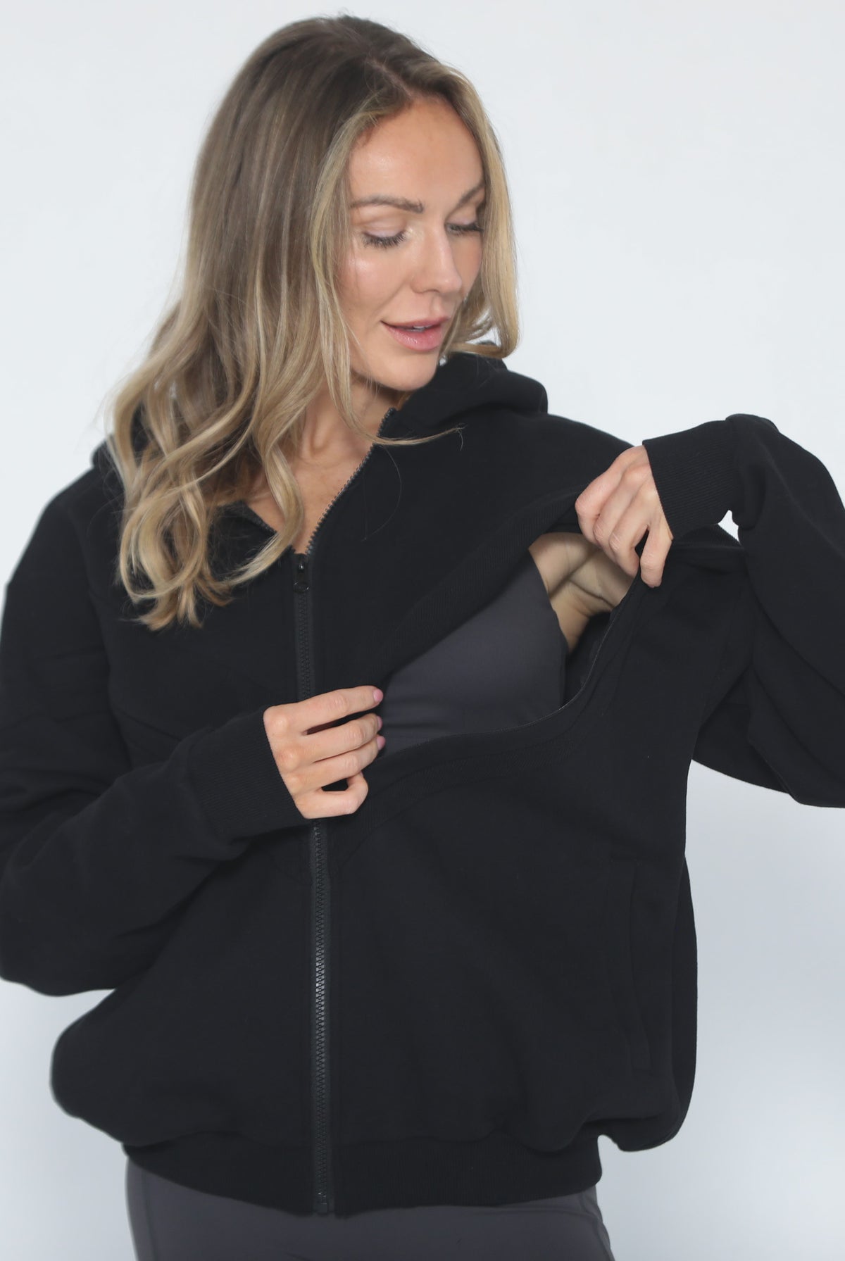Nursing hoodie, oversized, organic cotton, invisible zipper, sweat and milk, front shot with nursing zipper open for breastfeeding access