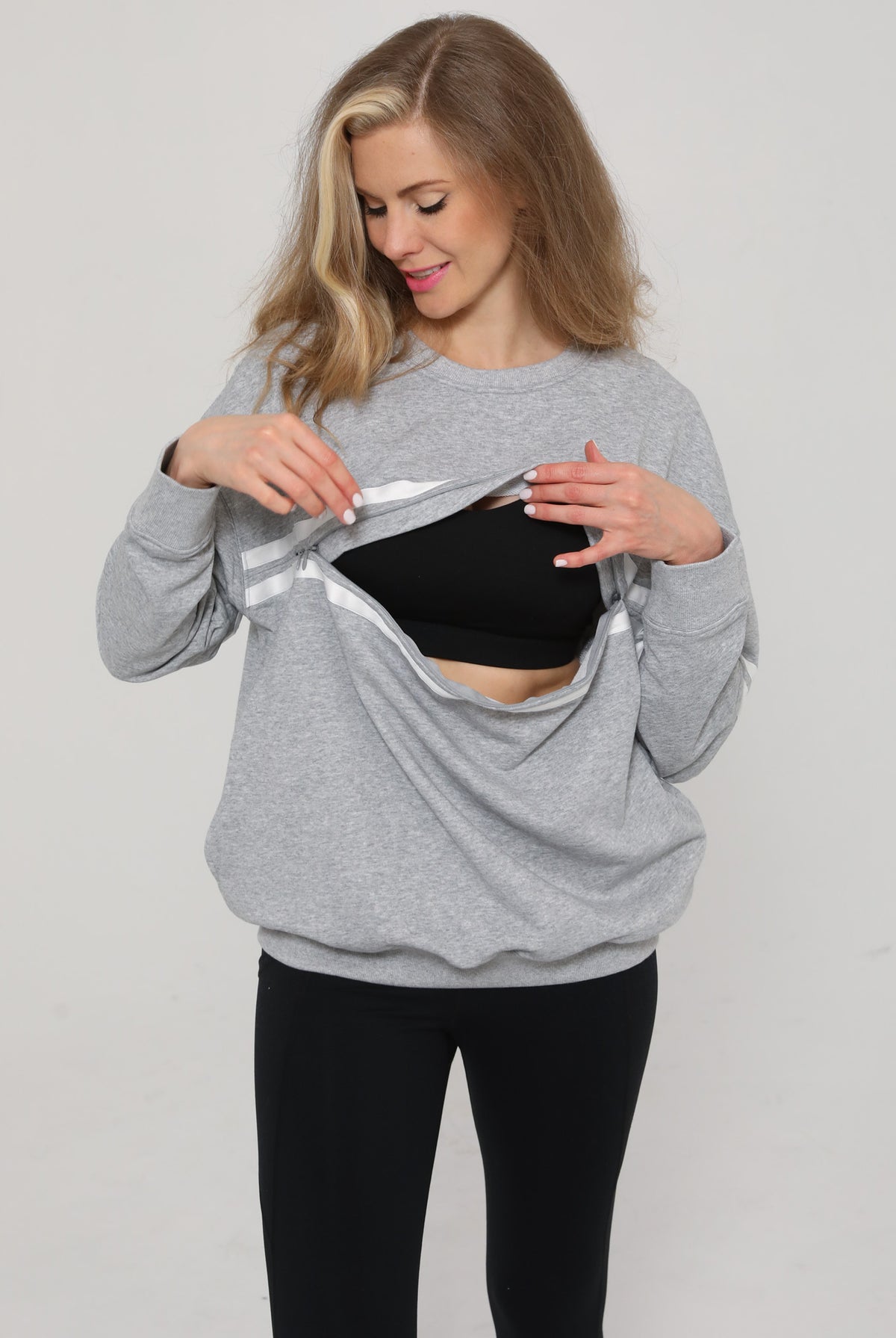 Close-up of the Celine Nursing Pullover in heather gray with zipper open, revealing discreet nursing access