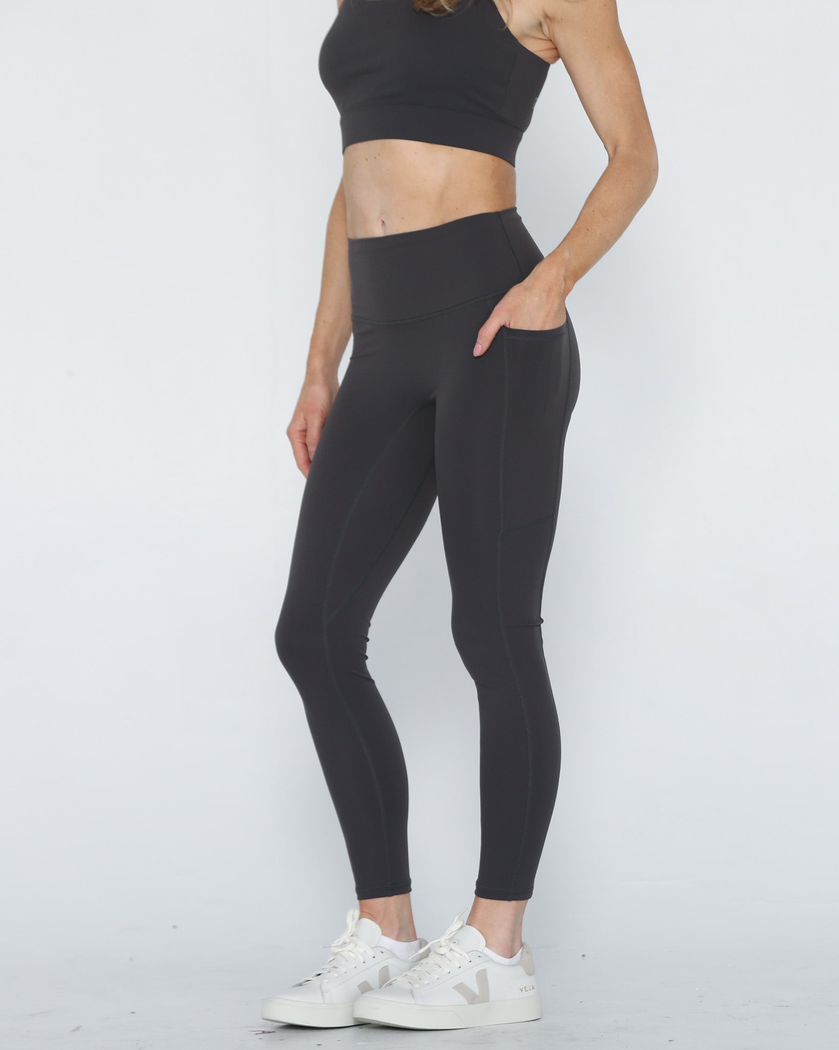 postpartum tummy control ultra high waisted leggings with pockets, side shot half body, sweat and milk