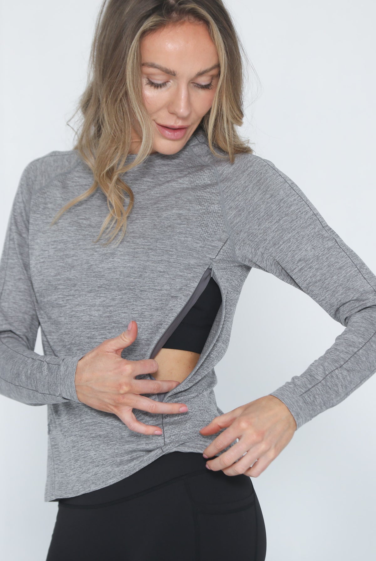 Aria seamless nursing top with dual invisible zippers, sweat and milk, front shot half body with zipper open for breastfeeding, heather gray