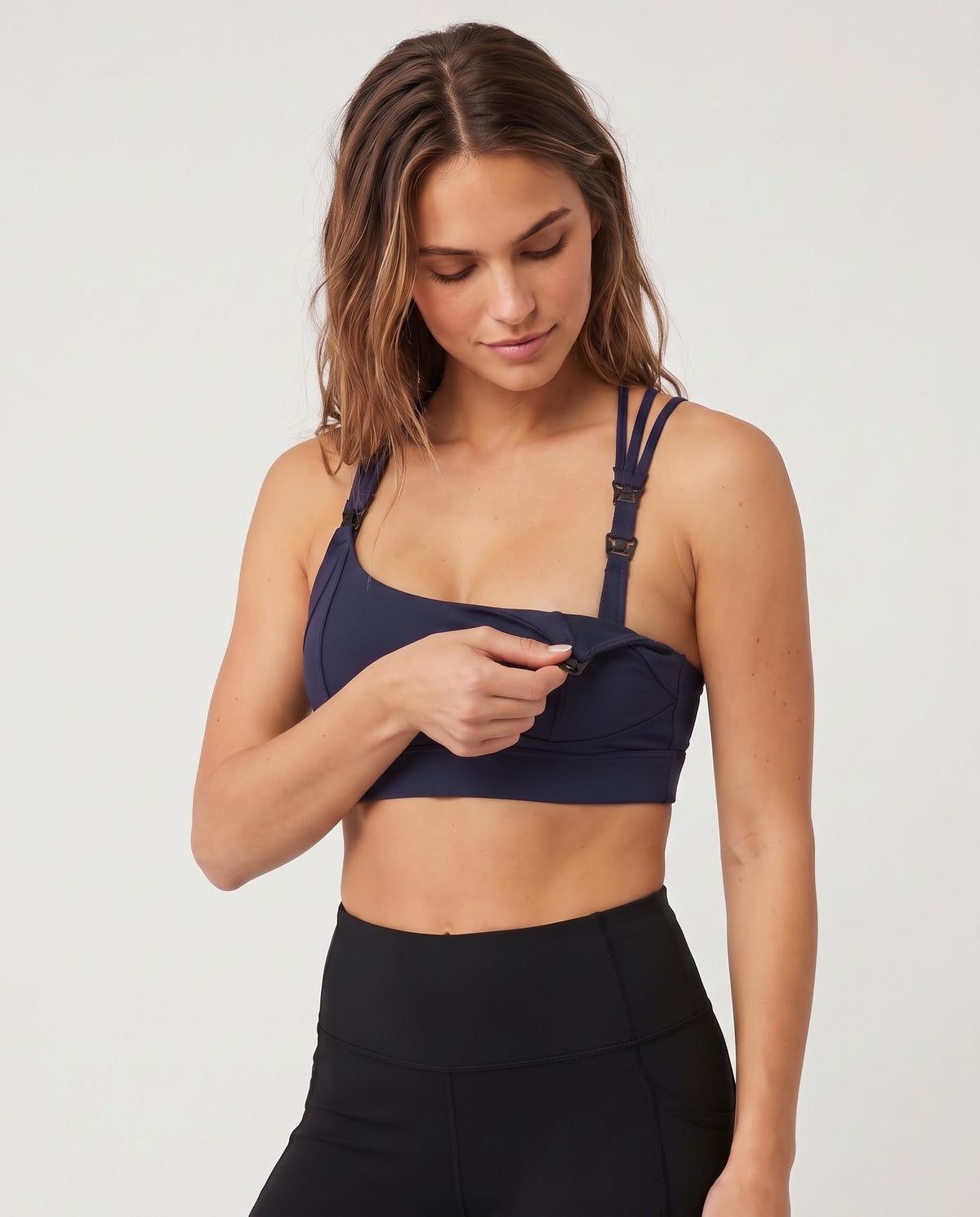 Chloe 5 running nursing sports bra with built in cups, non removable pads, high support, strappy back, adjustable band, nursing shot on model