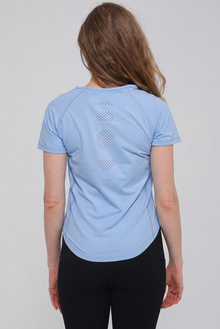 Mira running nursing top with dual zippers for easy access, light blue color, on model, front shot showing laser holes patterns. Sweat and milk