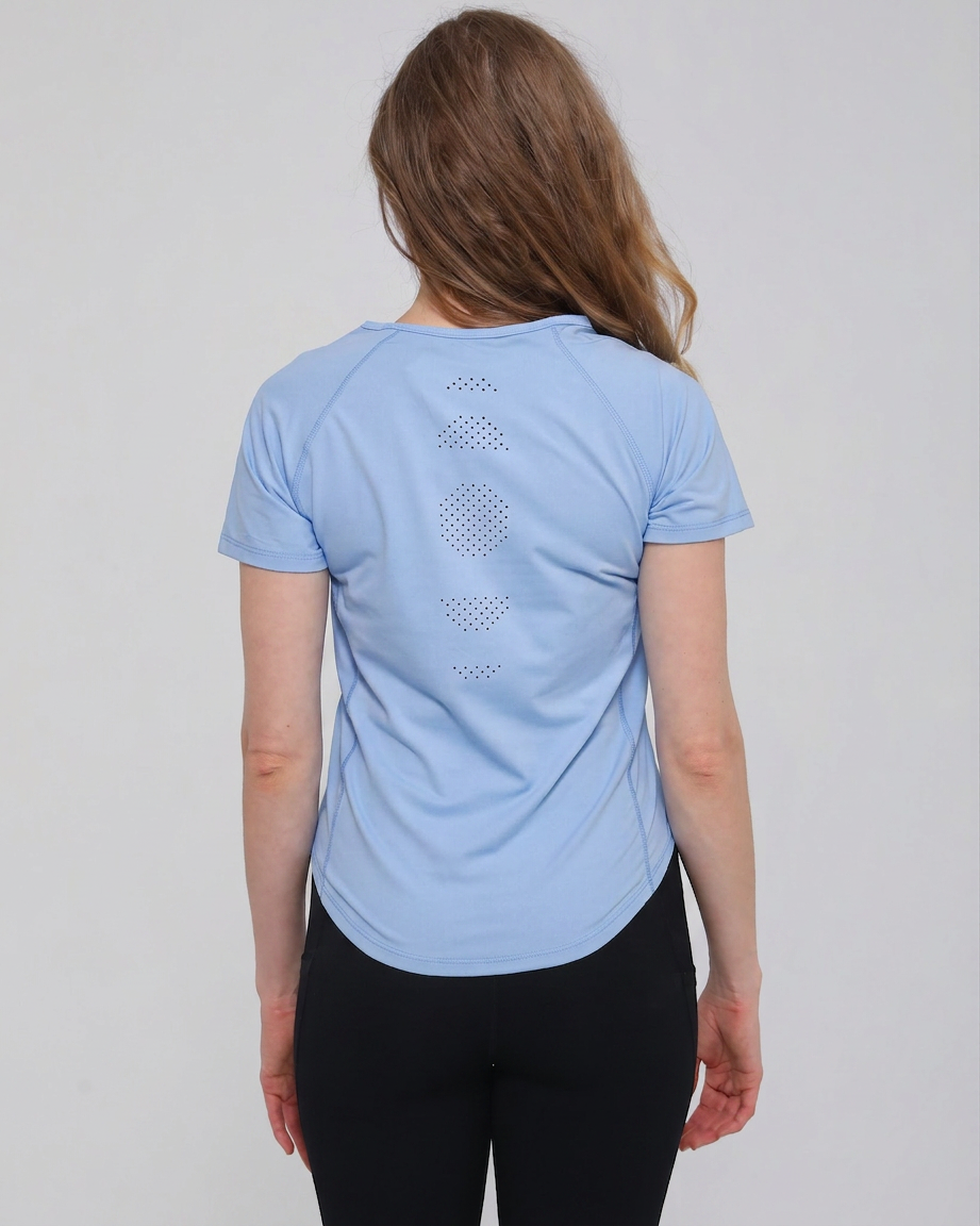 Mira running nursing top with dual zippers for easy access, light blue color, on model, front shot showing laser holes patterns. Sweat and milk