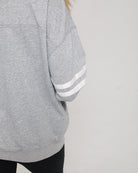 Close-up of the Celine Nursing Pullover sleeve, featuring two subtle tonal stripe details for a sporty accent