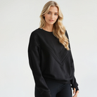 Isabella oversized nursing sweatshirt in organic cotton, side short on a model, sweat and milk