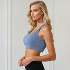 A mom wearing a Sweat and Milk's Venice 1 Lint Stone colored high impact nursing sports bra, side shot