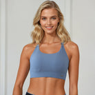 A mom wearing a Sweat and Milk's Venice 1 Lint Stone colored high impact nursing sports bra, front shot