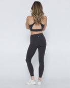 postpartum tummy control ultra high waisted leggings with pockets, side shot full body, sweat and milk