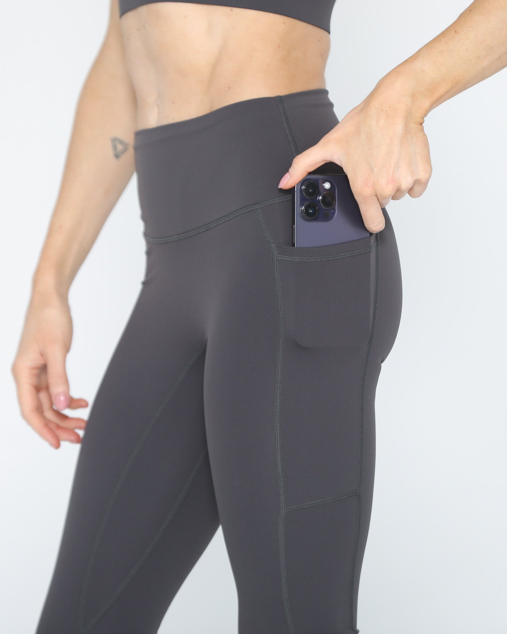 postpartum tummy control ultra high waisted leggings with pockets, side shot showing the pocket, sweat and milk
