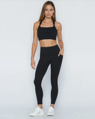 Postpartum ultra high waisted leggings, sweat and milk, with pockets, noir, front shot with hands in pocket, full body shot