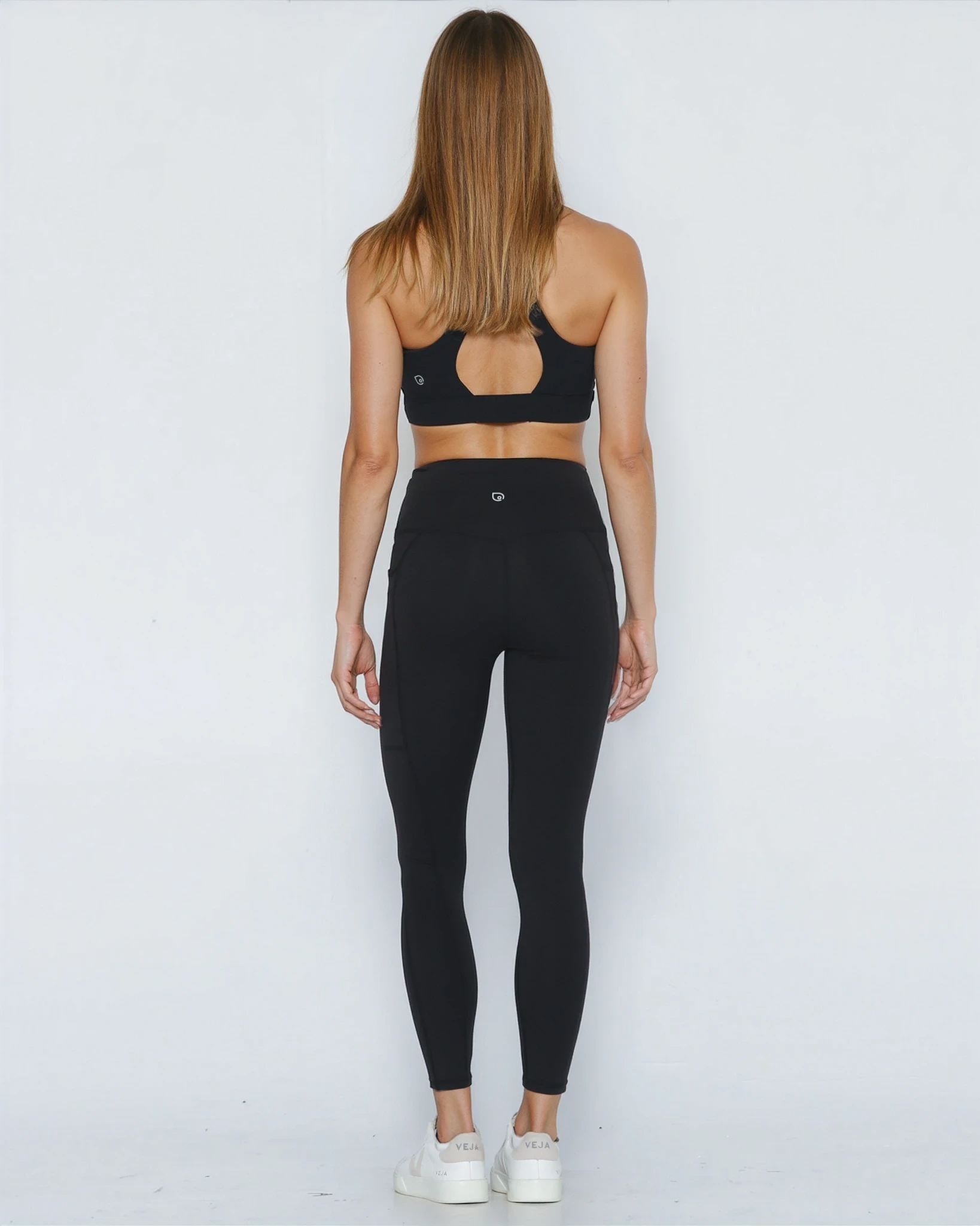 Postpartum ultra high waisted leggings, sweat and milk, with pockets, noir, back view shot with hands in pocket, full body