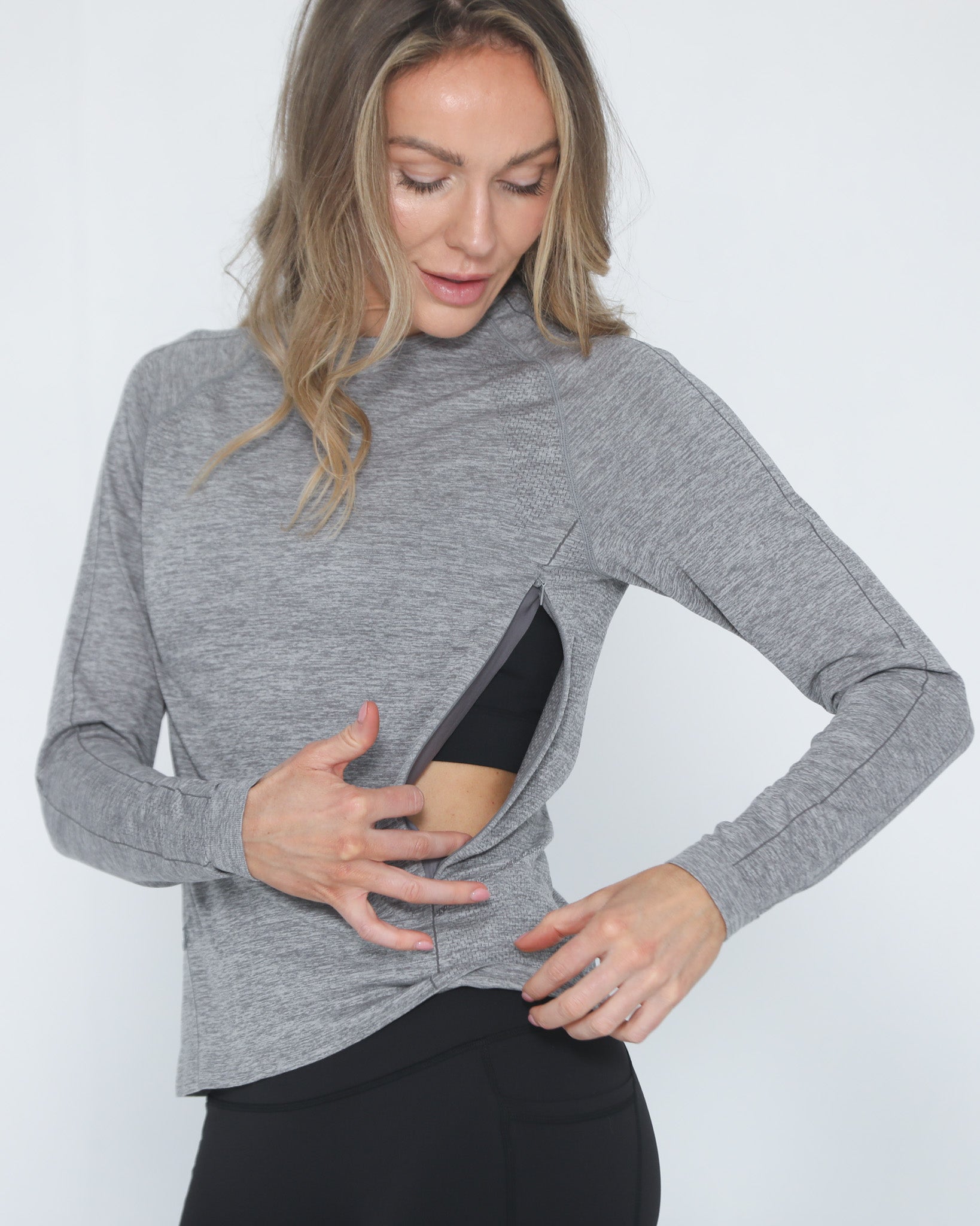 Aria seamless nursing top with dual invisible zippers, sweat and milk, front shot half body with zipper open for breastfeeding, heather gray