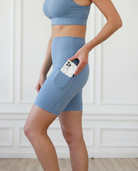 ultra high-rise postpartum biker shorts with pockets, sweat and milk, malibu blue, side shot showing pockets