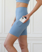 ultra high-rise postpartum biker shorts with pockets, sweat and milk, malibu blue, side shot showing pockets