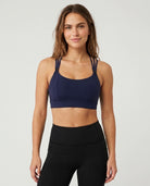 Chloe 5 running nursing sports bra with built in cups, non removable pads, high support, strappy back, adjustable band, front shot on model