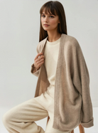 Cashmere cardigan on model, front shot, sweat and milk